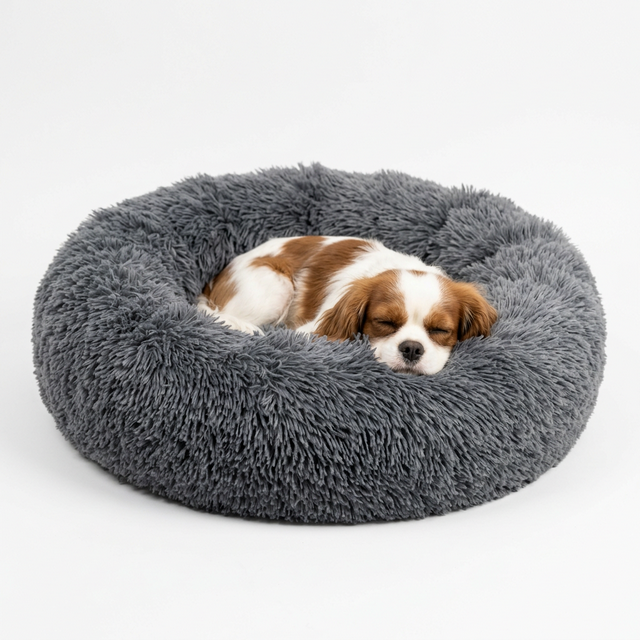 Calming donut pet bed in warm sand beige with deep bolstered rim for anxious dogs and cats